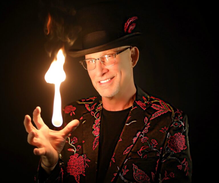 A fireball burning in Danger Magic's open palm